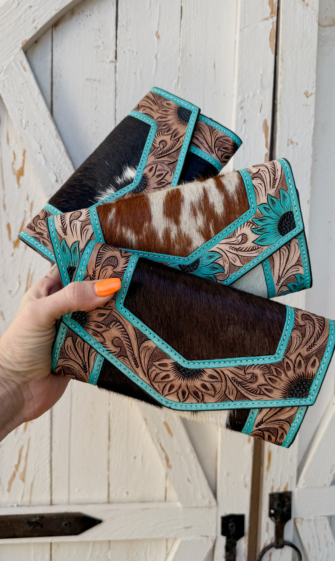 Western cowhide wallet with turquoise leather trim and tooled leather detailing