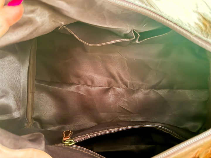 Interior of cowhide leather weekender bag with zip pocket