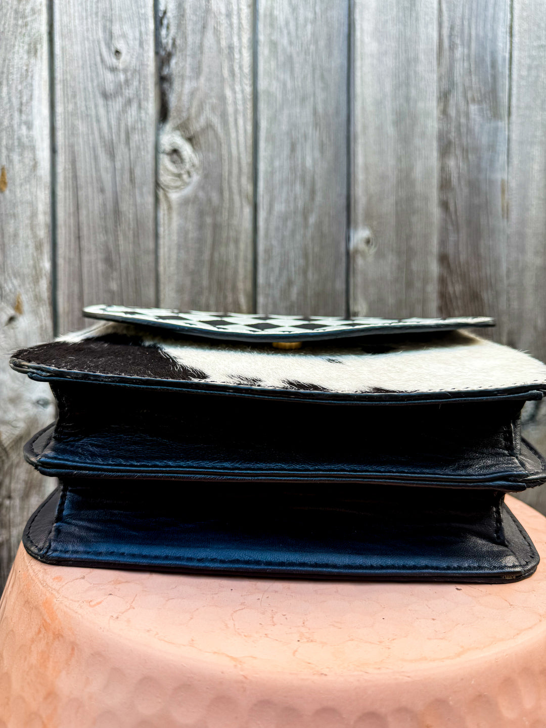Bottom view of Speed Check saddle crossbody purse showing two divided compartments