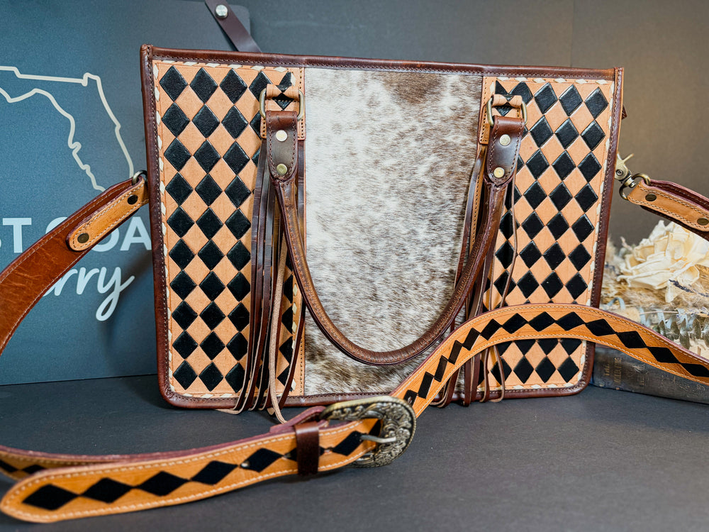 Artisan-crafted cowhide and leather tote bag from East Coast Carry.