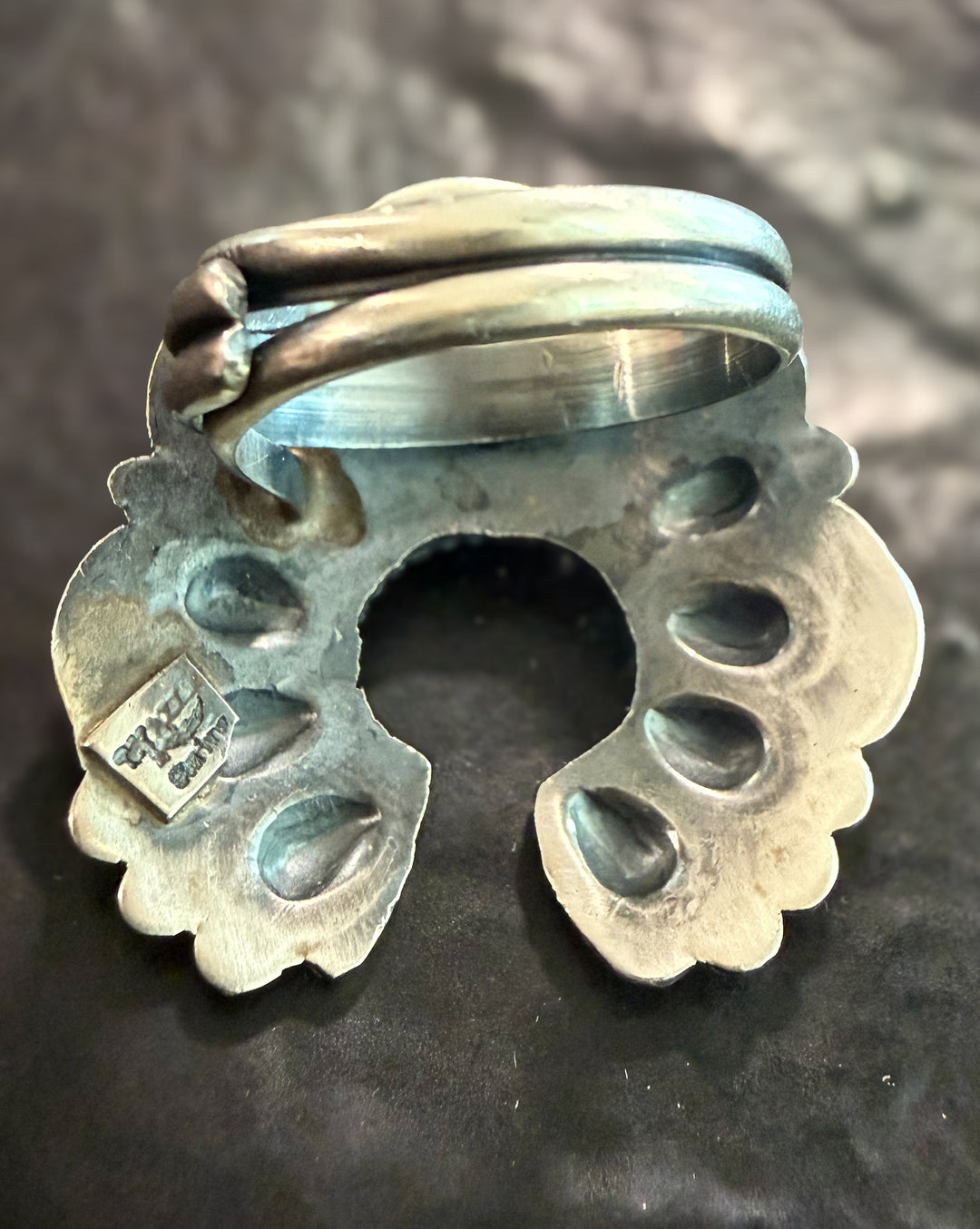 Back of handmade Navajo naja ring showing sterling silver craftsmanship and adjustable band