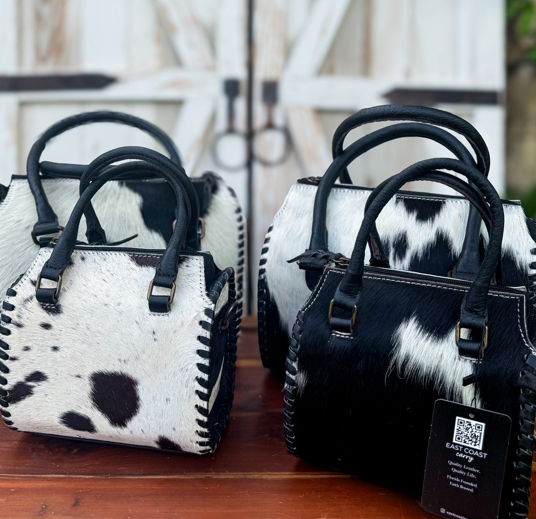 Cowhide leather carryall bag with structured speedy style shape, dual handles and detachable crossbody strap