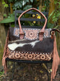 The Frontier Fringe Carryall : Cowhide, tooling, fringe, and function. Includes concealed carry pocket and two ways to wear