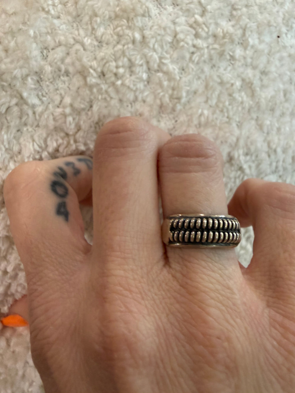 Navajo Sterling Silver Beaded Raindrop Band Ring  by Richard Mike in size 7.5 shown worn on finger for size 
