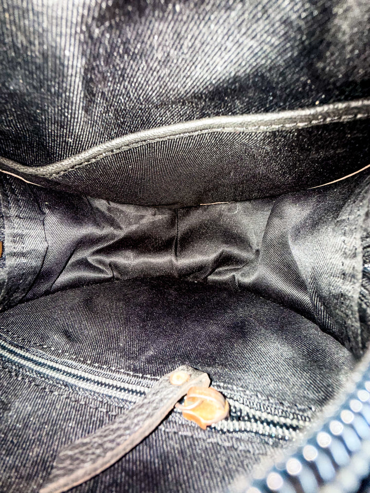 Inside of Speed Check canteen purse showing lined interior pocket and zipper closure