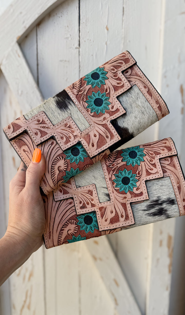Turquoise Bloom tooled leather cowhide wallet with turquoise flower accents and black and white hair on hide
