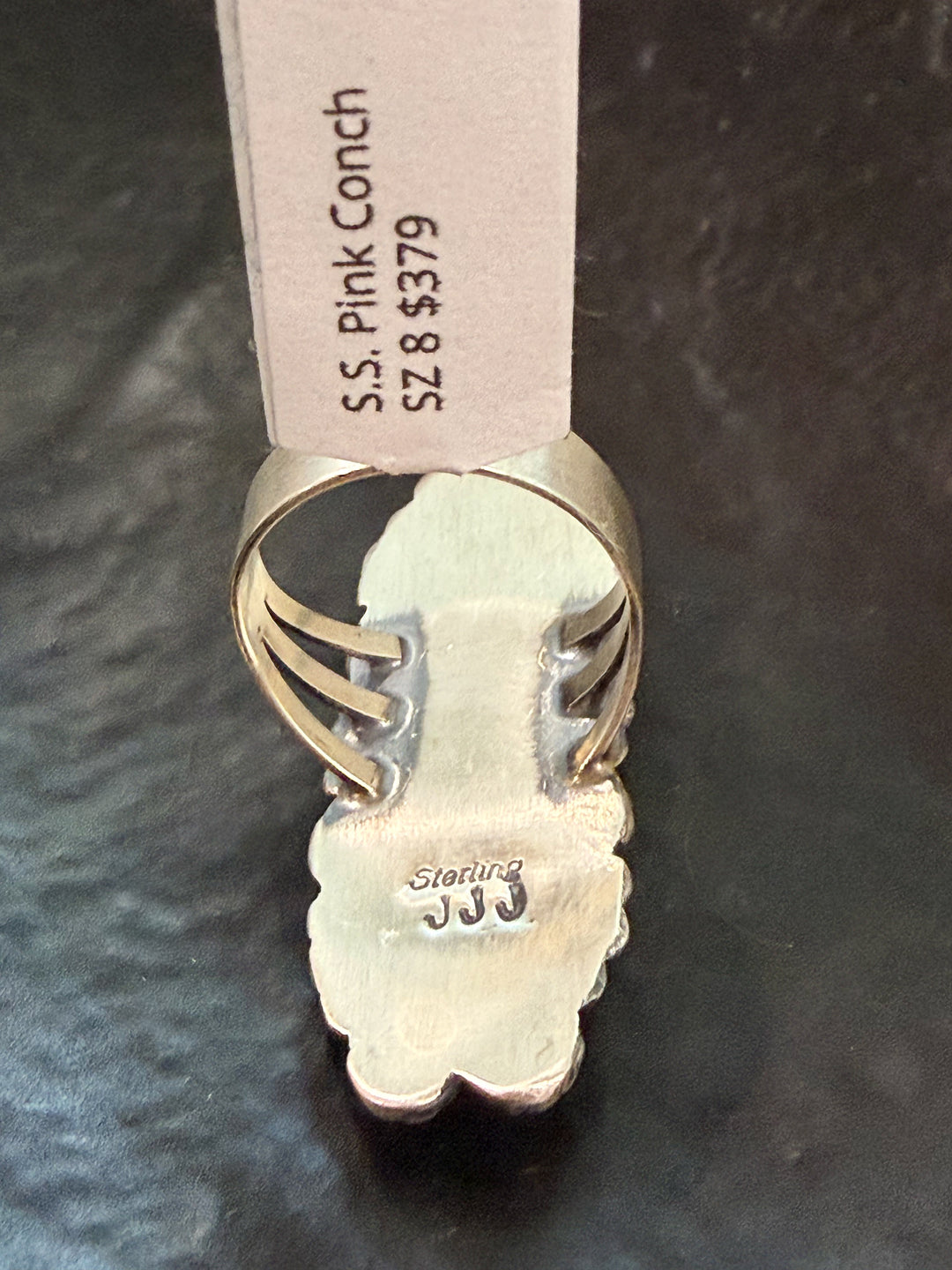 Back view of pink conch cluster Navajo ring handmade Native American jewelry signed JJ for Jeff James Jr. 