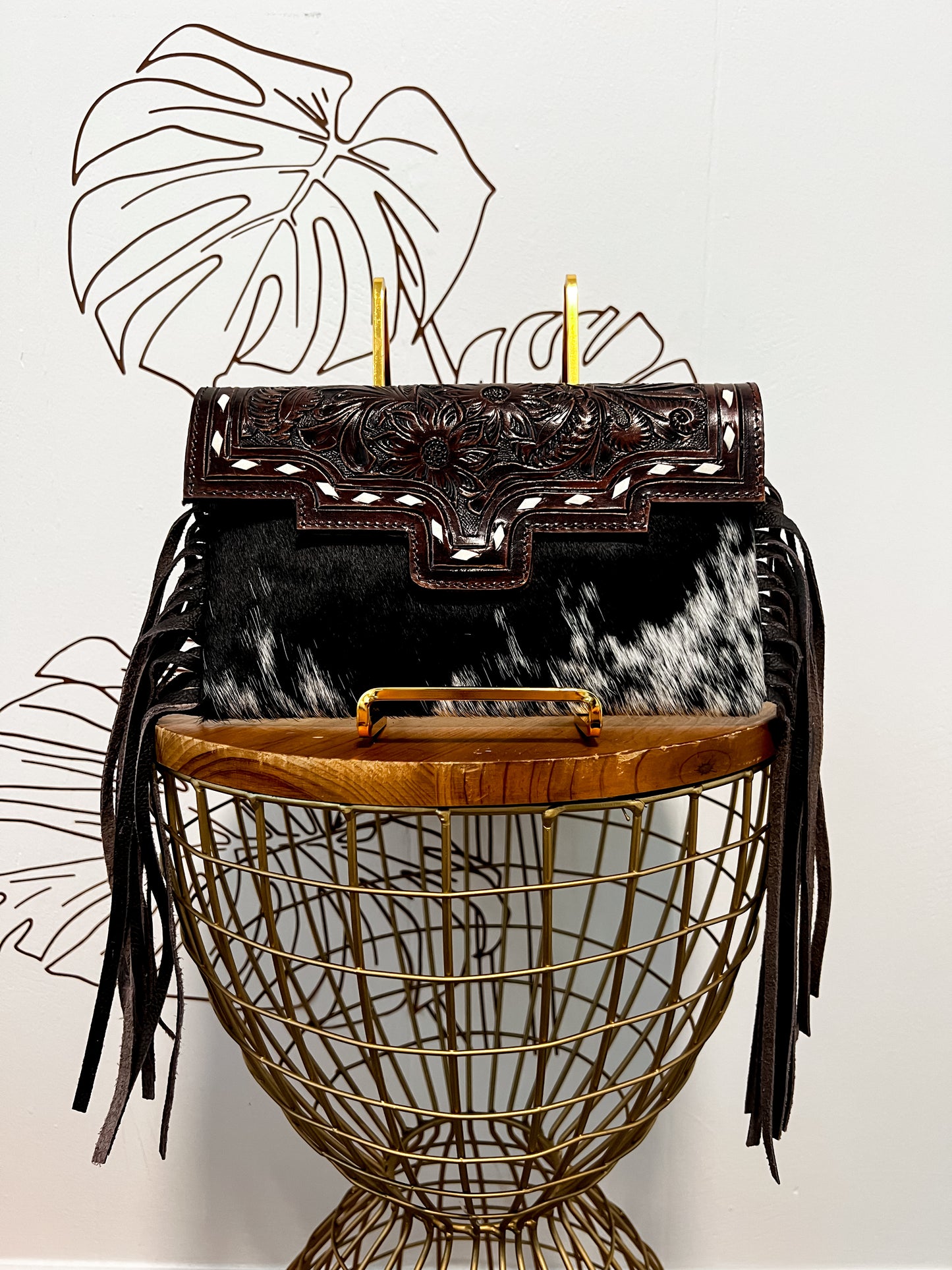 Fancy Seeing you Here: Tooled Brown Leather and Black Cowhide Hand Clutch
