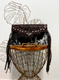 Fancy Seeing you Here: Tooled Brown Leather and Black Cowhide Hand Clutch