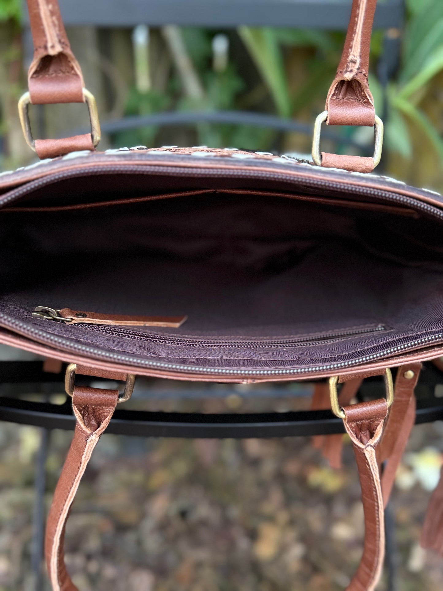 The Frontier Fringe Carryall : Cowhide, tooling, fringe, and function. Includes concealed carry pocket and two ways to wear
