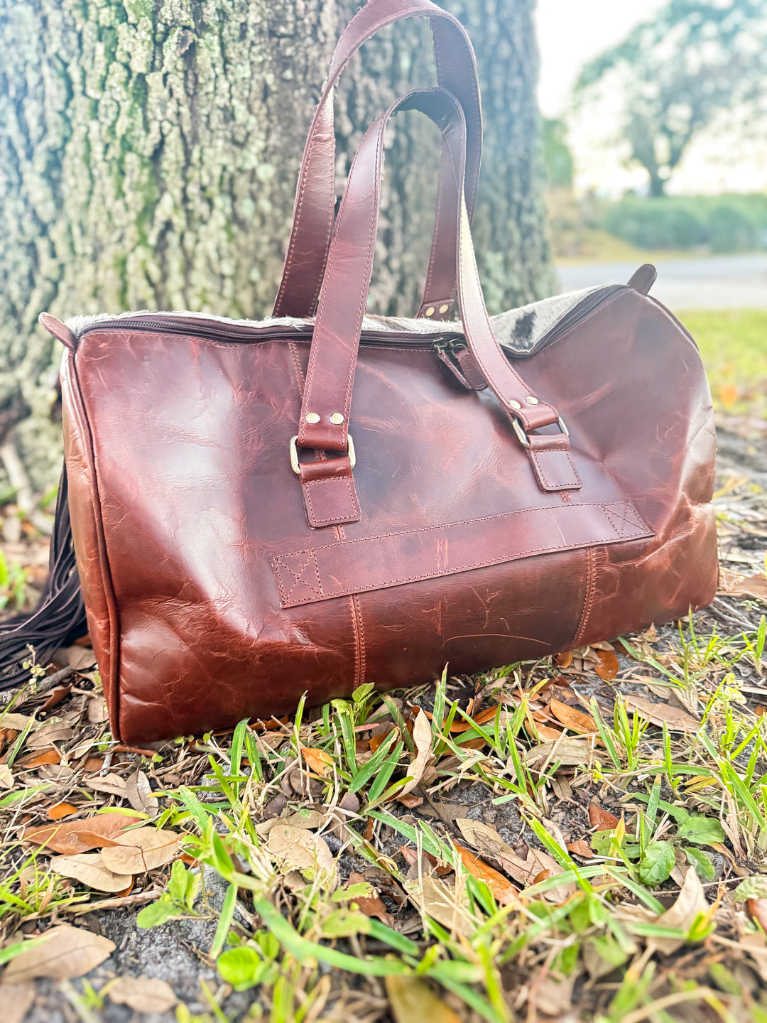 Brown leather cowhide weekender bag with top handles