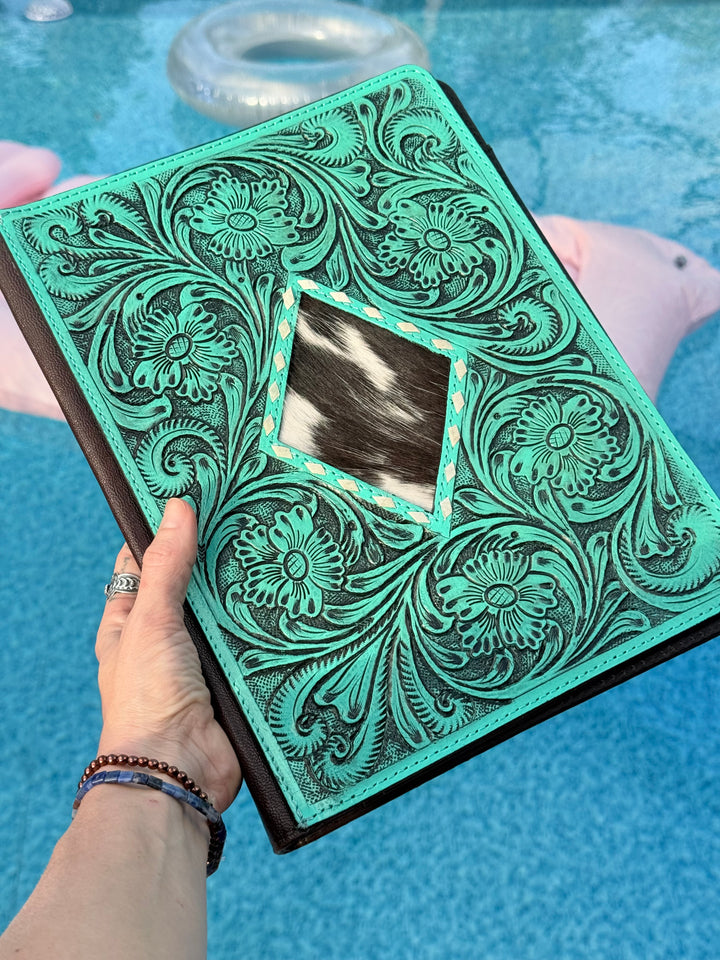 Turquoise tooled leather office Padfolio organizer with a black and white cowhide diamond shaped center piece 