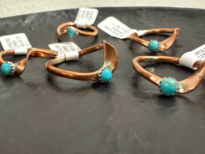 Navajo copper turquoise rings in various sizes