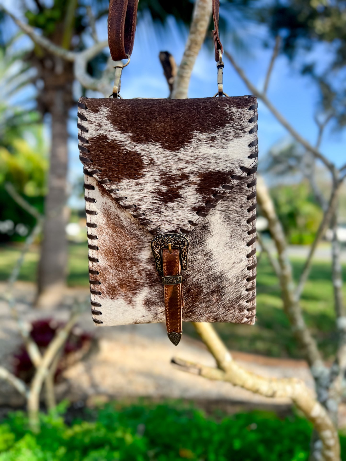 Cowhide buckle crossbody / carry bag