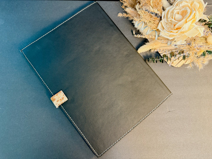 Back of Western-style tooled leather and cowhide portfolio from East Coast Carry.