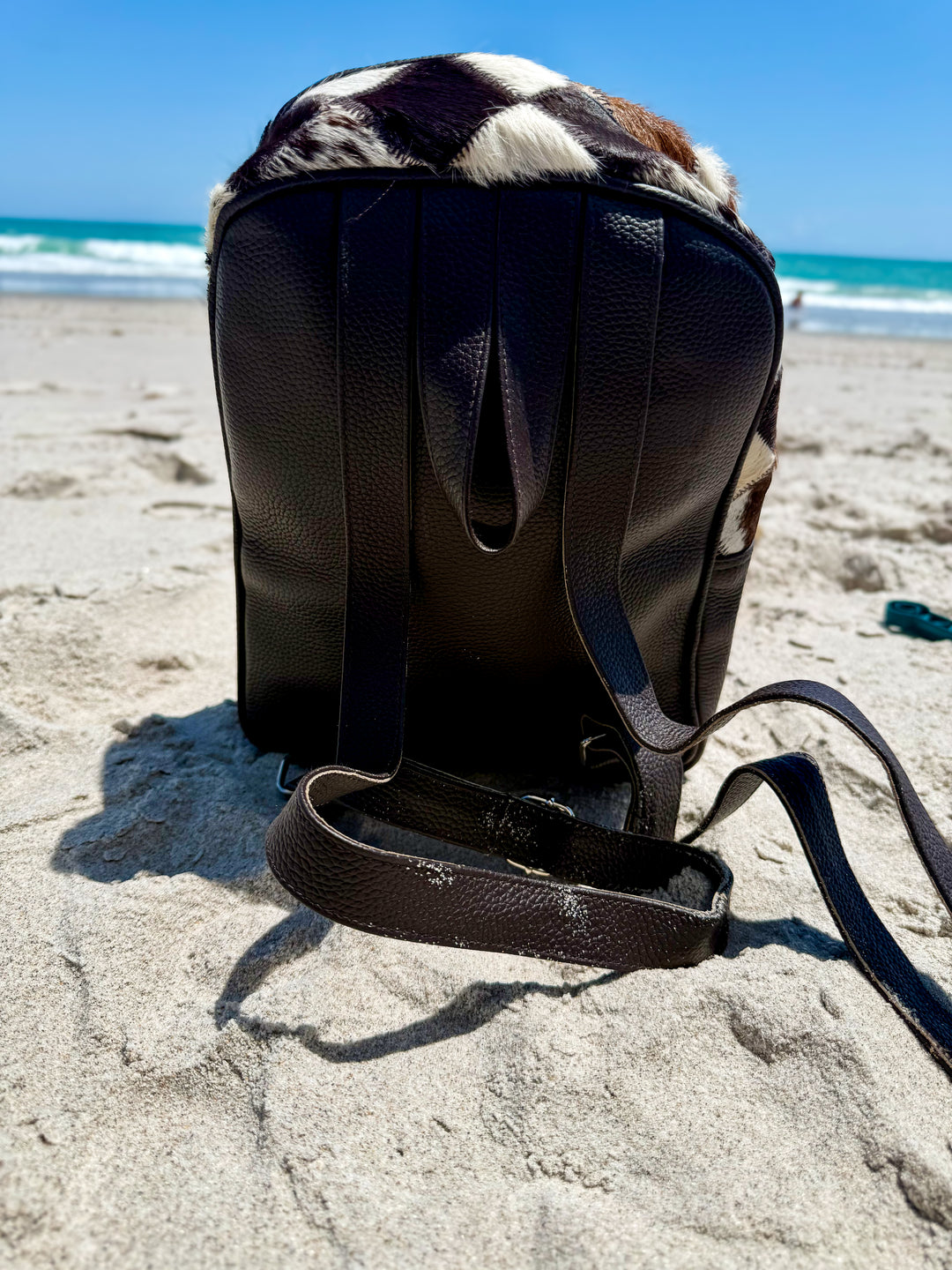 Back of the  cowhide patchwork mini backpack leather western bag