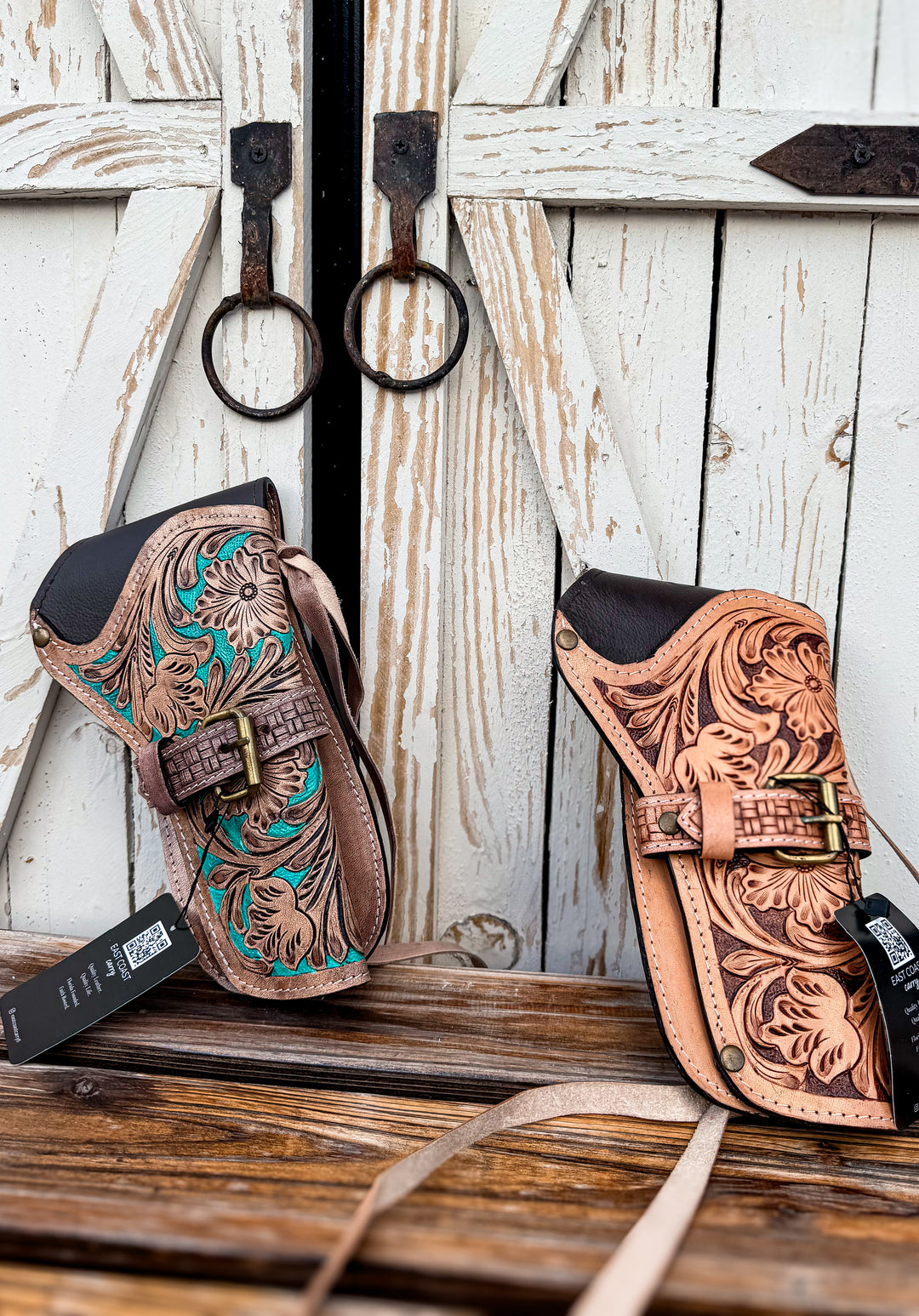 Tooled leather western side holster styled against rustic barn doors with genuine leather craftsmanship and old-west inspired detailing.