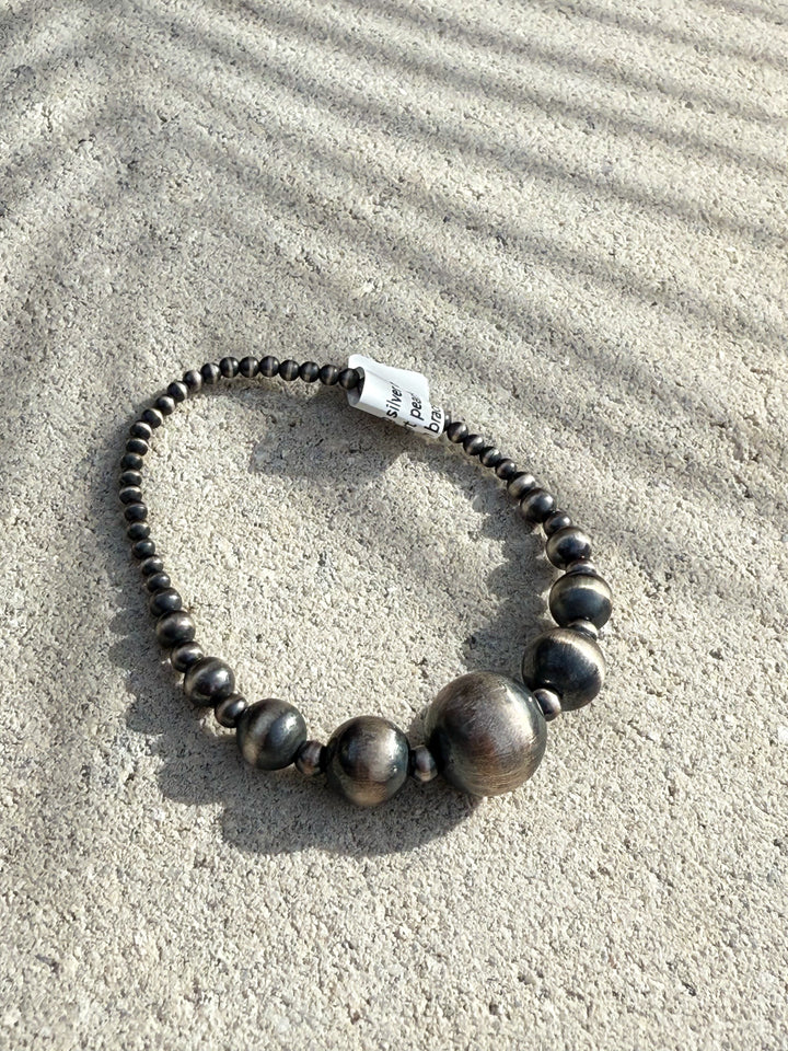 Southwest-inspired sterling silver bead stretch bracelet graduated design close up