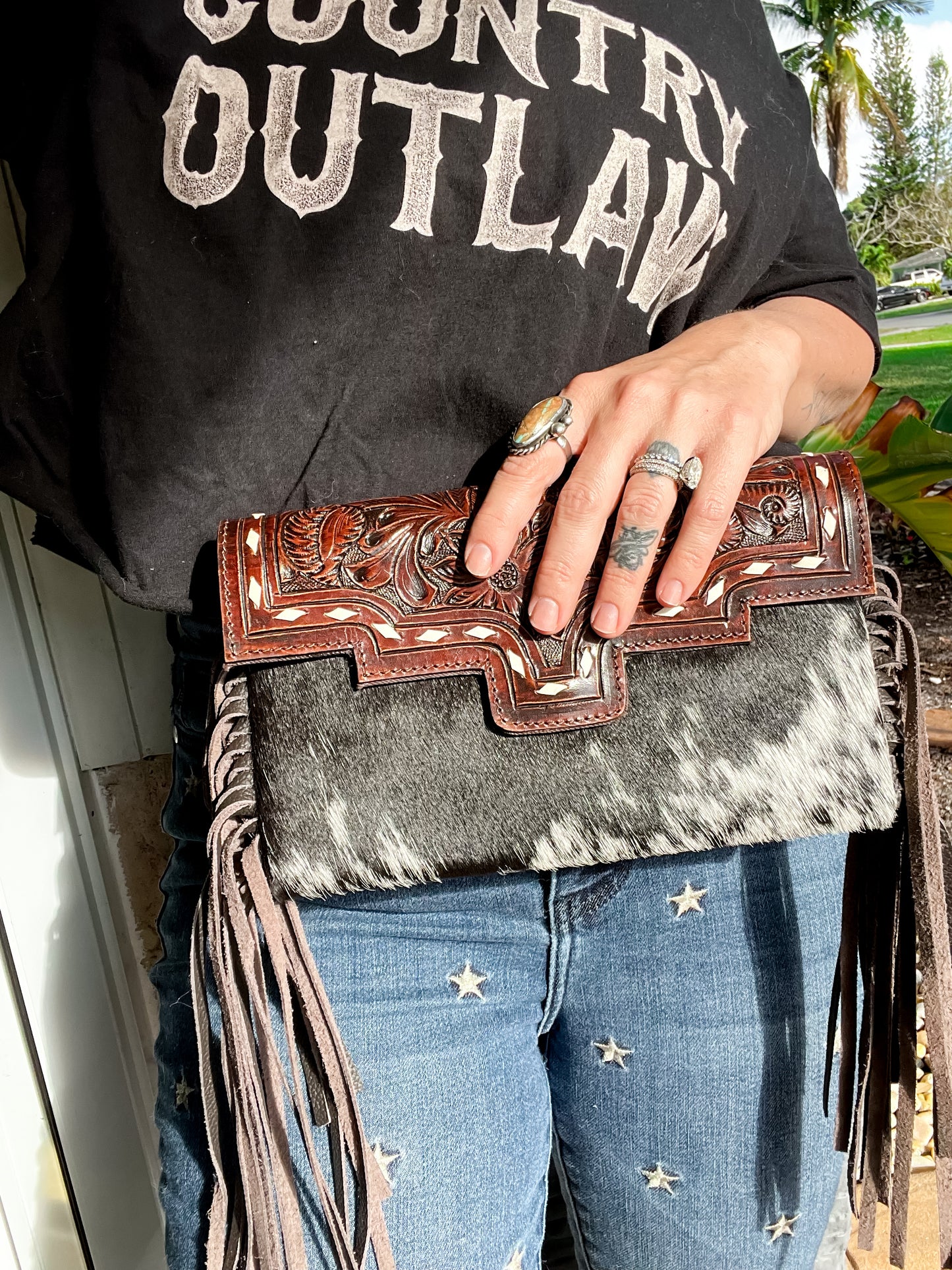 Fancy Seeing you Here: Tooled Brown Leather and Black Cowhide Hand Clutch