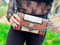 Hand Tooled brown leather and cowhide clutch with strap