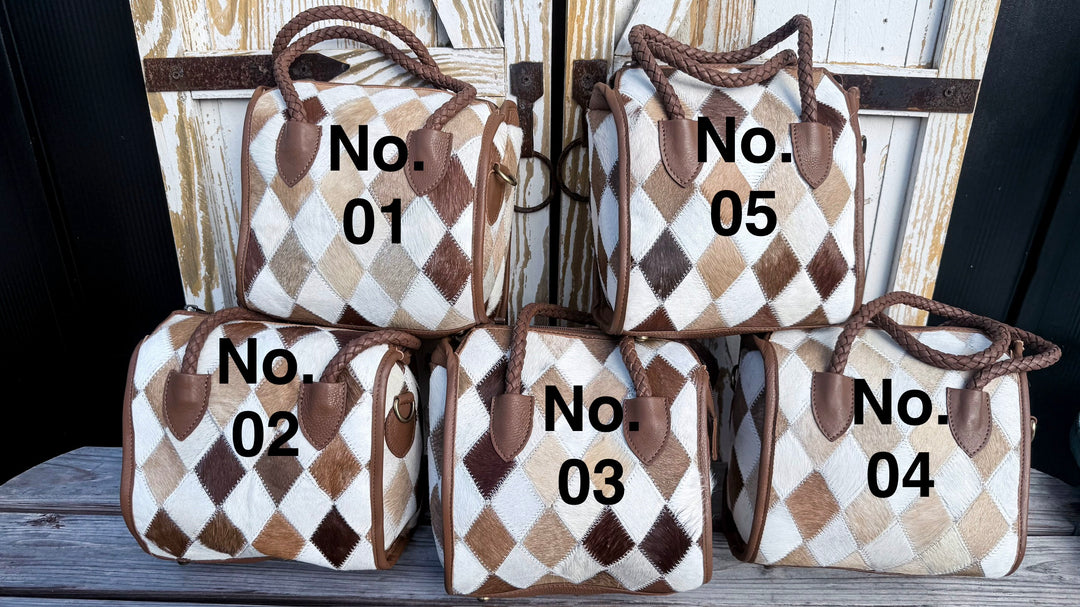 Four diamond patchwork cowhide satchels photographed with individual bag numbers for selecting a unique hide pattern.